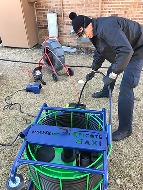 Billy, owner of Drainline Services, running a sewer camera inspection on a job